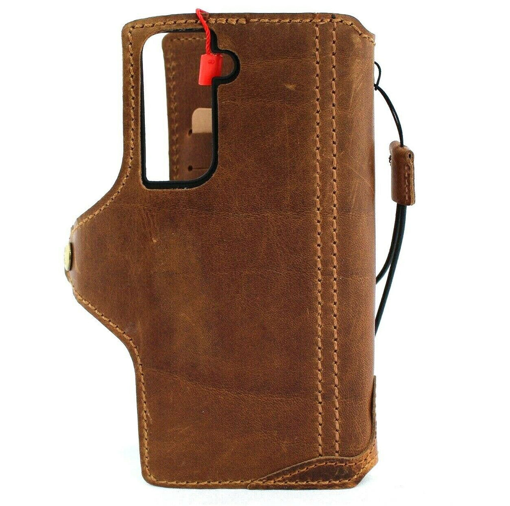 Handmade genuine leather Samsung Galaxy S21 book wallet case in tan with rubber holder, slim design, compatible with wireless charging.