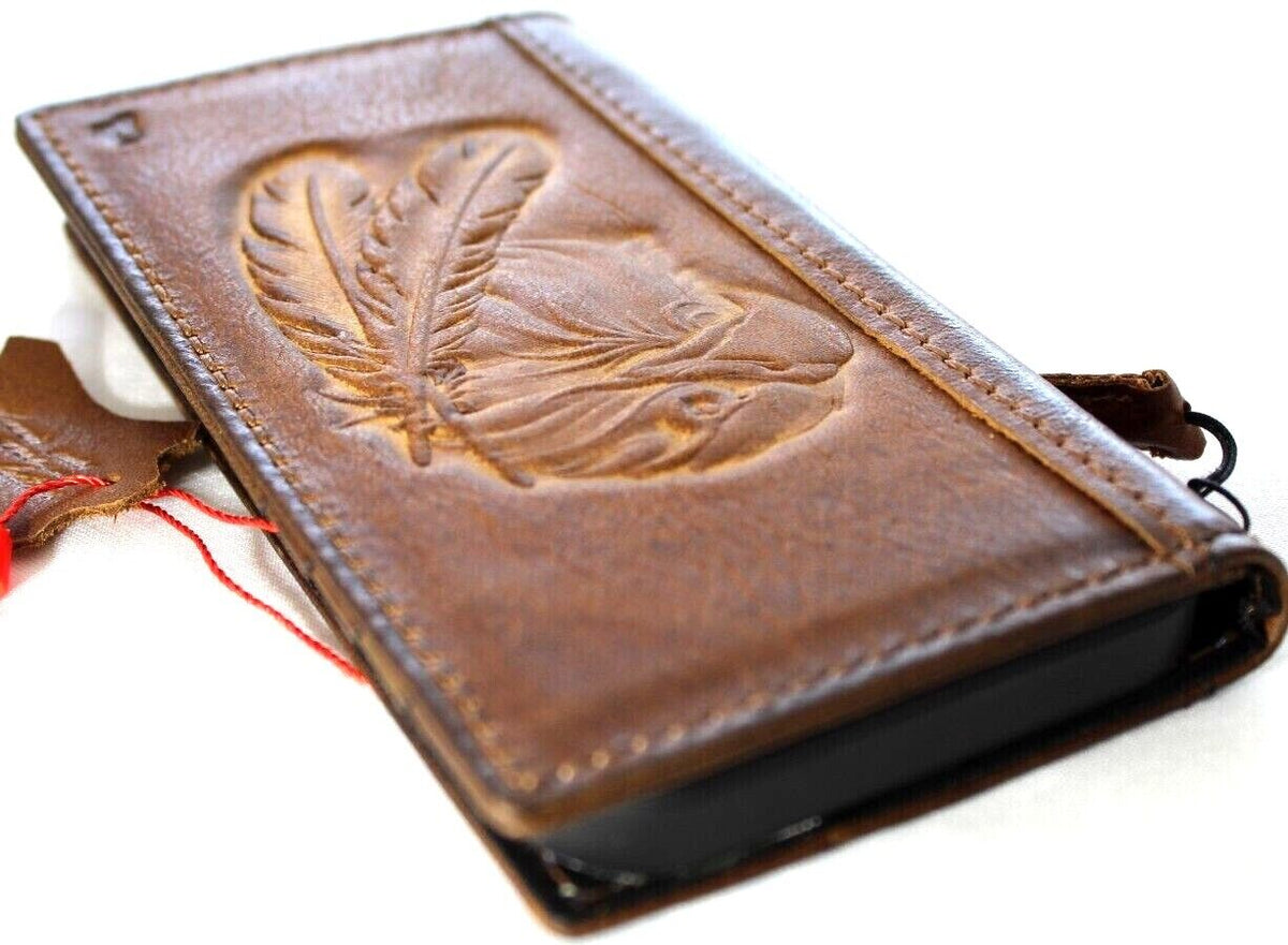 Handmade genuine leather phone case for iPhone 13-18 Pro Max with eagle crafts falcon design and card slots in vintage tan color.