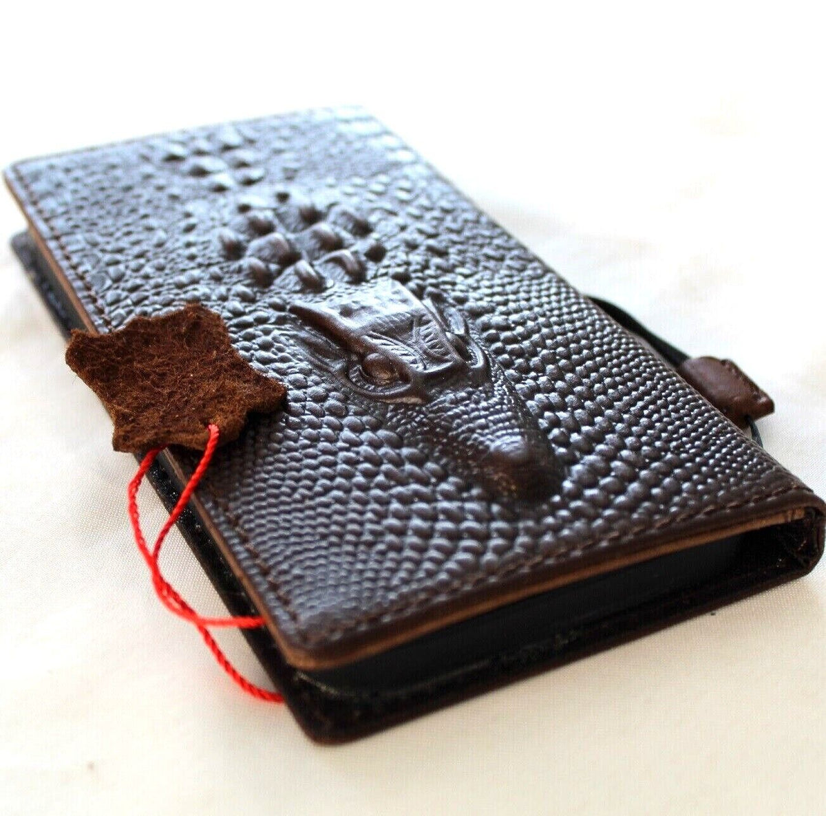 Google Pixel 7 Pro leather case by DAVISCASE with crocodile design, wallet style, stand feature, and wireless charging compatibility.