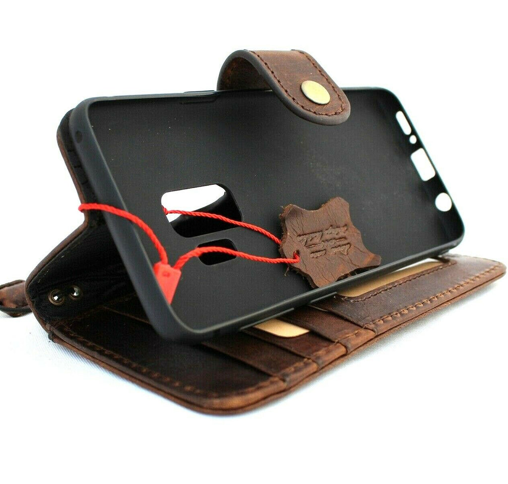 Handmade dark Italian leather wallet case for Samsung Galaxy S9 with rubber holder and wireless charging compatibility.