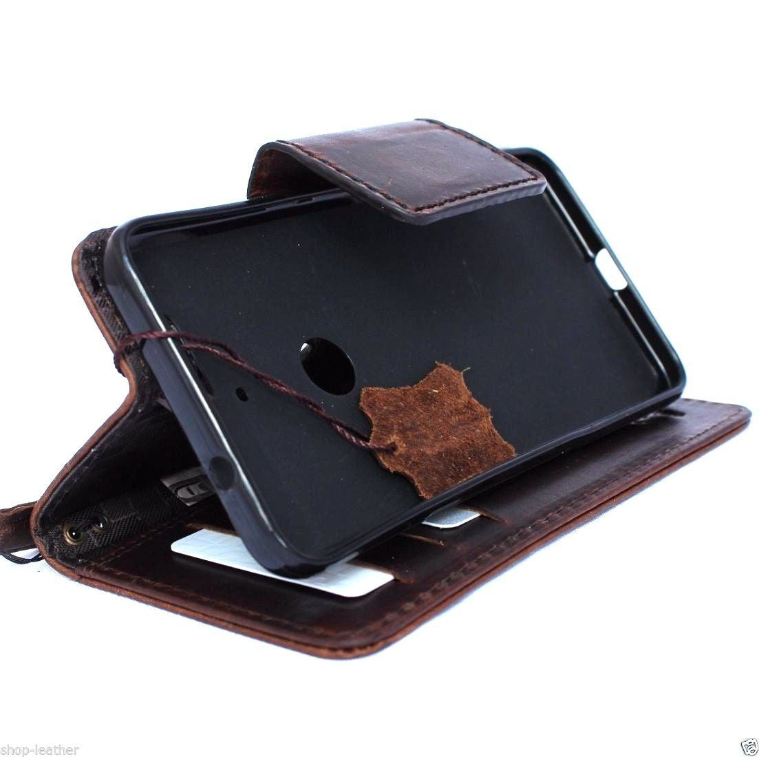 Handmade brown leather phone case for Huawei Nexus 6P with book wallet design and magnet closure, showcasing vintage artisan craftsmanship.