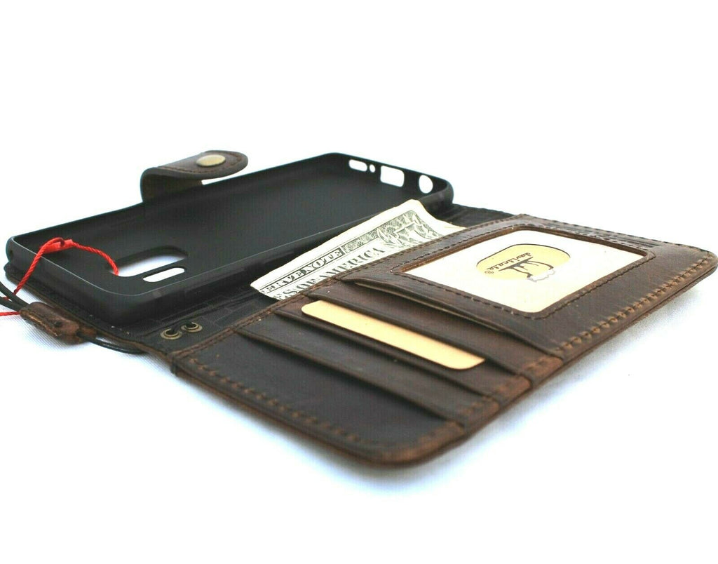 Dark genuine Italian leather case for Samsung Galaxy S9, handmade wallet-style phone cover with rubber holder, wireless charging compatible.