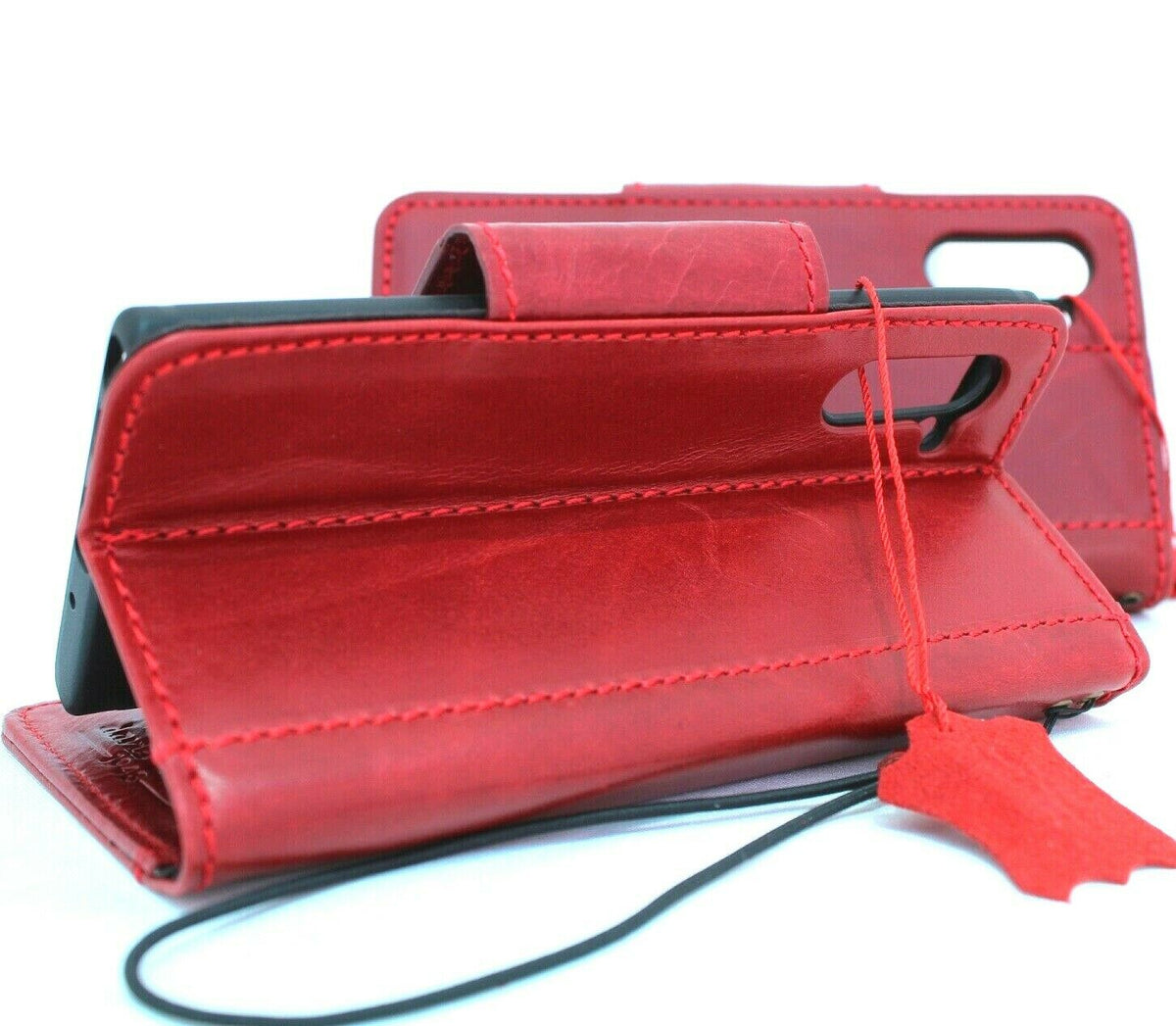 Red genuine leather flip wallet case for Samsung Galaxy Note 10, with magnetic closure and wireless charging compatibility.