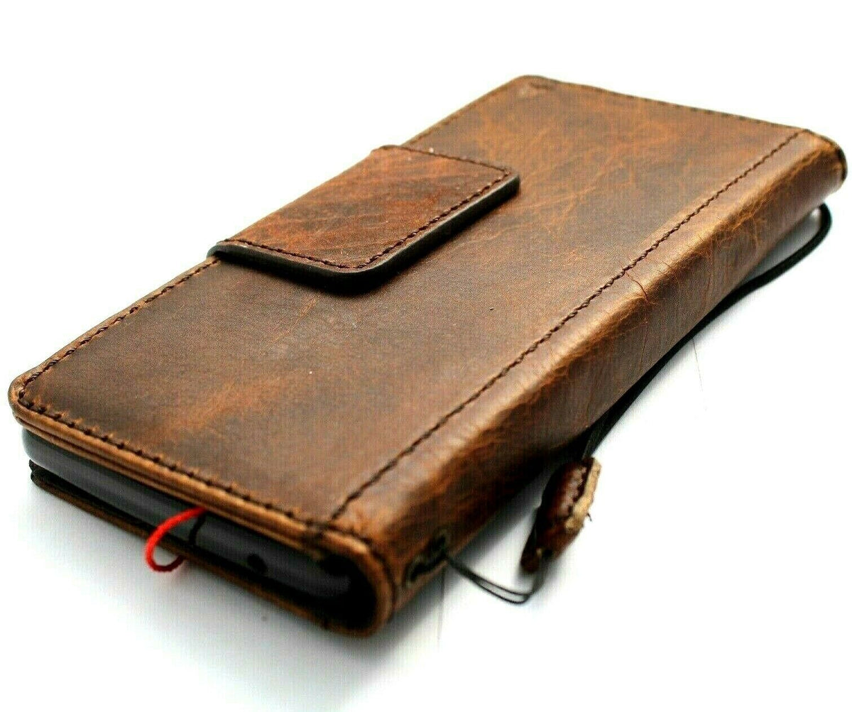Google Pixel 7A leather case by DAVISCASE with magnetic closure, wallet design, stand feature, and wireless charging compatibility.