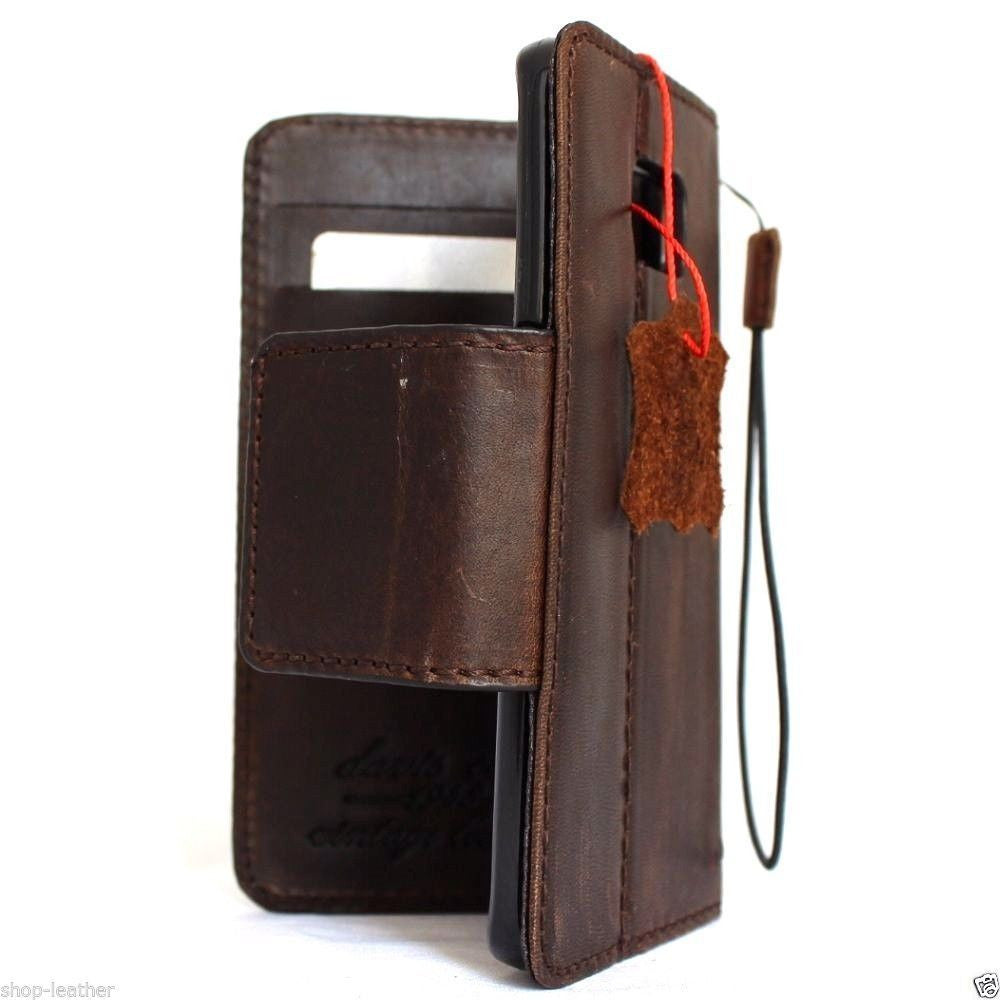 Handmade brown leather wallet case for Samsung Galaxy S8 Plus with magnetic strap and book-style design.