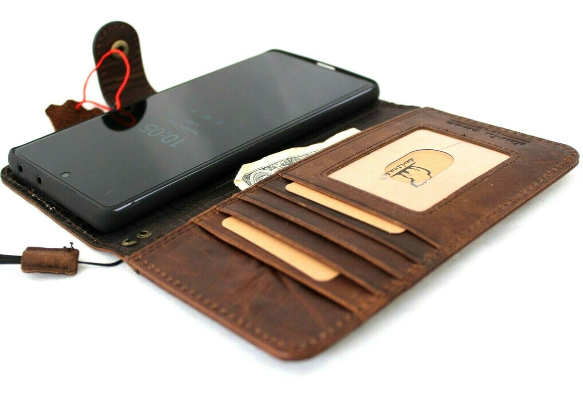 Dark brown DAVISCASE genuine top grain leather wallet phone case for Samsung Galaxy S21 Ultra 5G with handmade craftsmanship and rubber holder.
