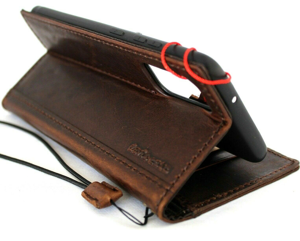 Genuine leather OnePlus 15 case by DAVISCASE with wallet design, card slots, ID holder, and wireless charging compatibility.