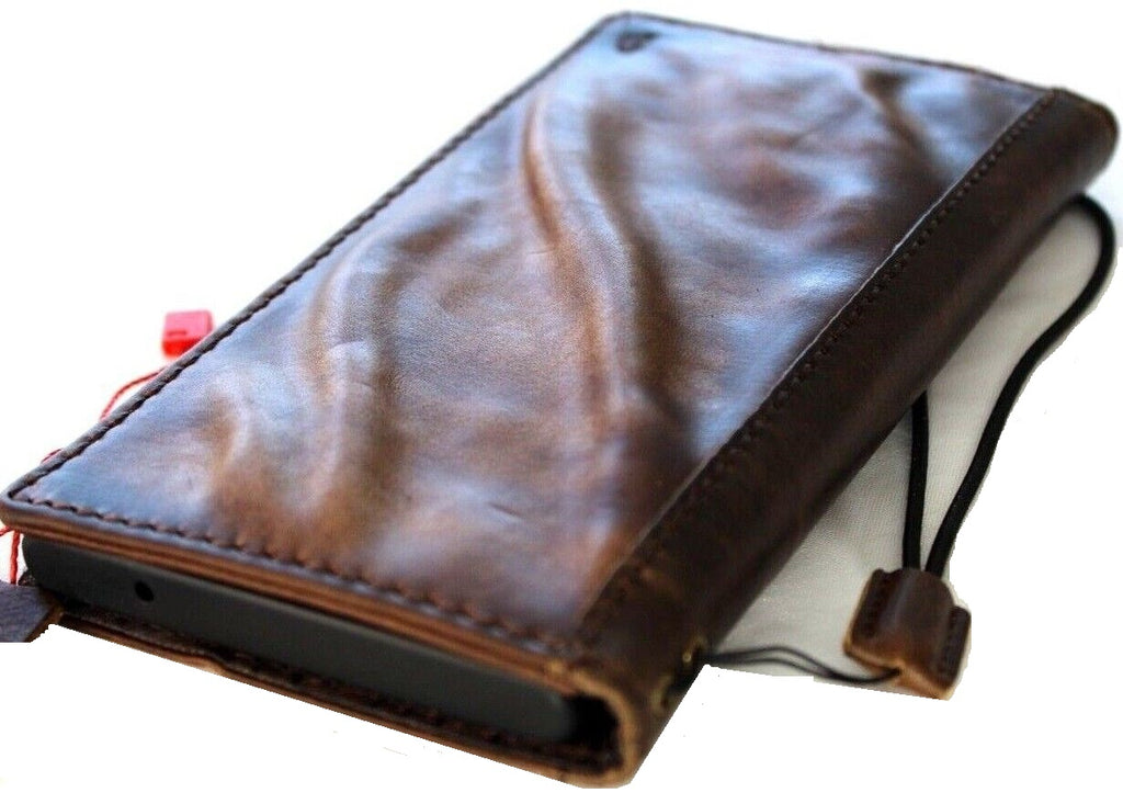 Handcrafted genuine leather phone case for iPhone and Samsung, vintage style with card slots and wallet features by DAVISCASE.
