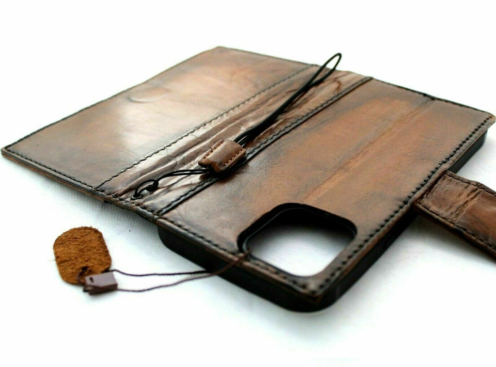Dark leather Apple iPhone 11 Pro case by DAVISCASE featuring vintage wallet design, credit card slots, magnetic closure, and slim profile.