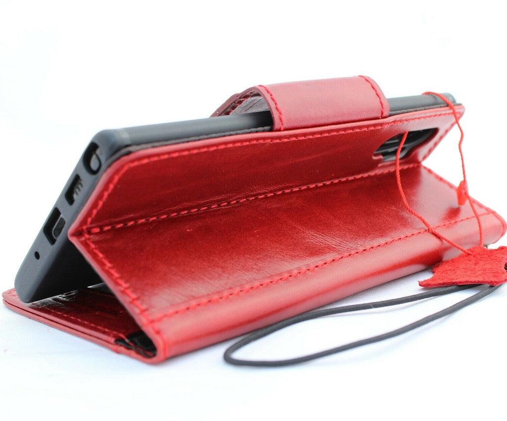 Red genuine leather flip wallet case for Samsung Galaxy Note 10 Plus with card slots and magnetic closure by DAVISCASE.