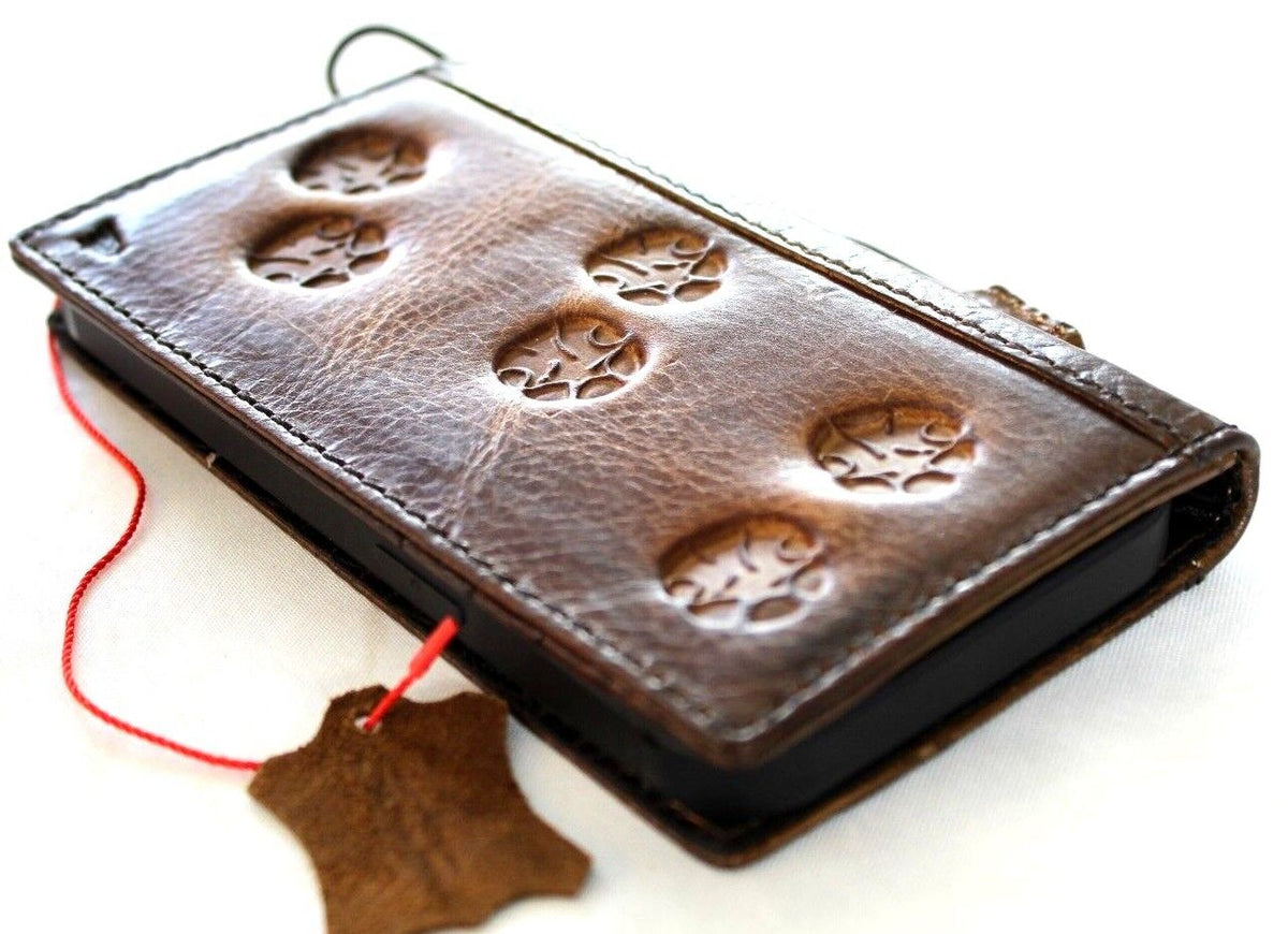 Handmade leather phone case by DAVISCASE for Galaxy S22, A51, Note 10, and more with vintage paw elephant design.