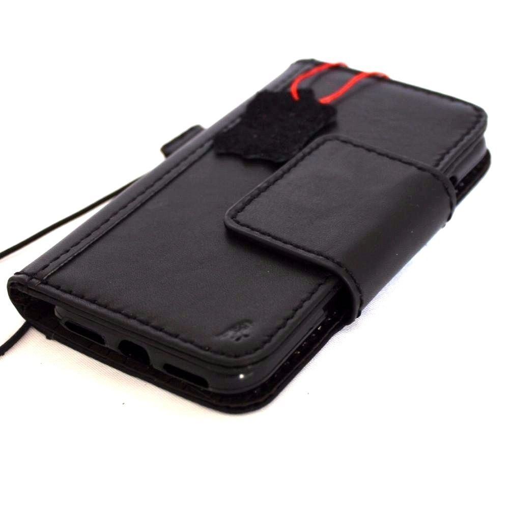 Black genuine leather iPhone 8 case with wallet design, card slots, magnetic closure, compatible with wireless charging.