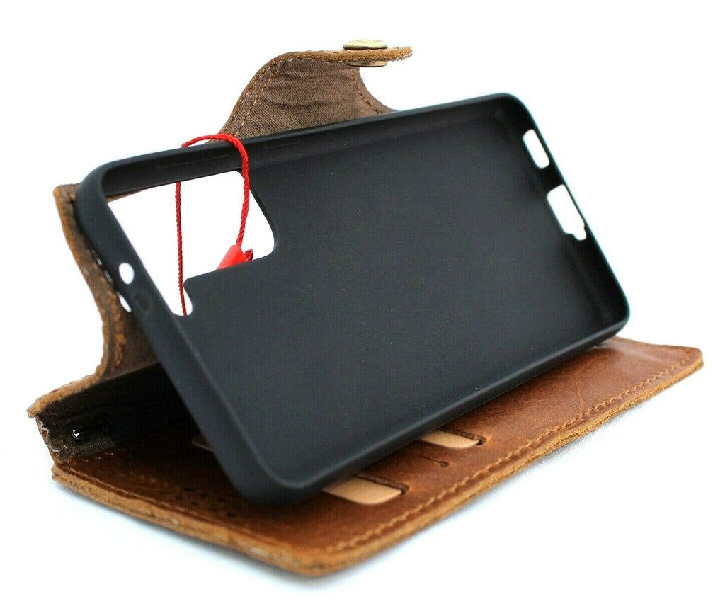 Handmade tan leather phone case for Samsung Galaxy S21 with wallet design, rubber holder, slim fit, and wireless charging compatibility.