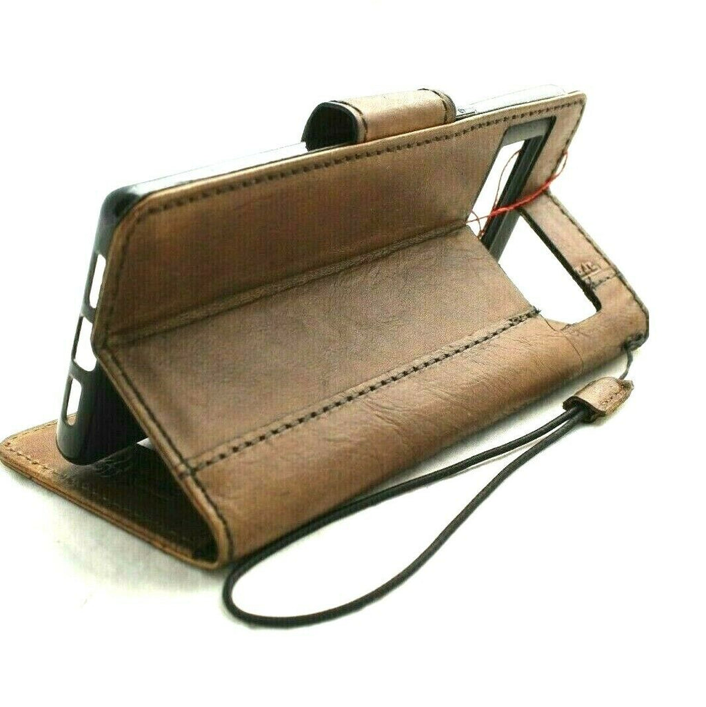 Google Pixel 7 Pro leather wallet case by DAVISCASE with magnetic closure, stand feature, and retro design for wireless charging.