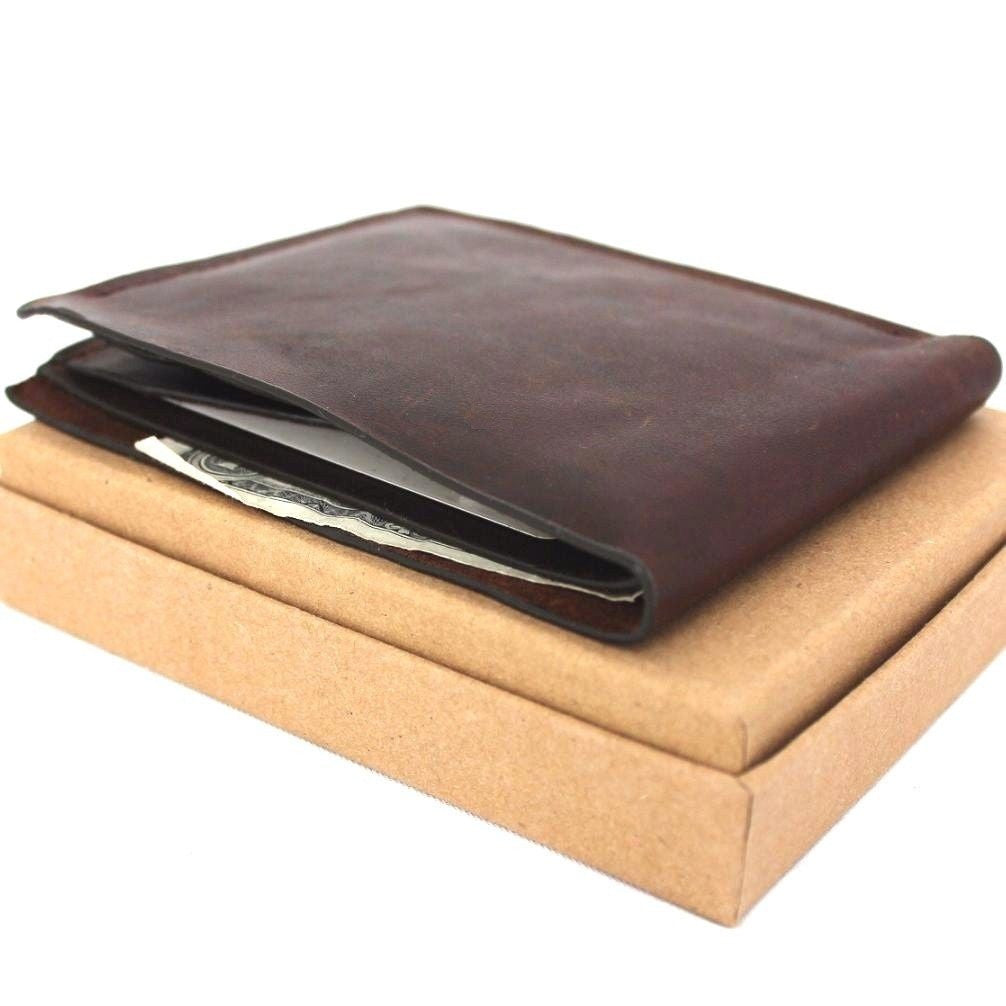 Men's brown leather wallet by DAVISCASE with 4 credit card slots and a bill compartment, slim and handmade design.