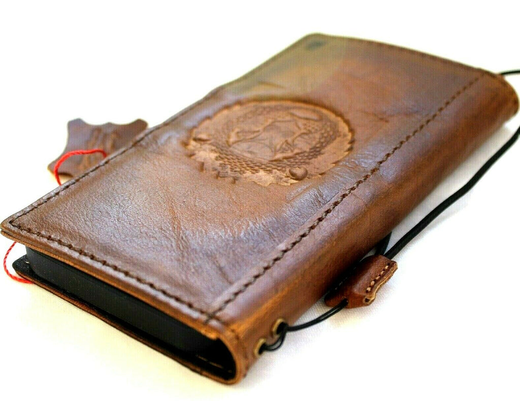 Handcrafted genuine leather wallet case for Apple iPhone 11-15 Pro Max, featuring vintage lion design, credit card slots, and full grain leather.