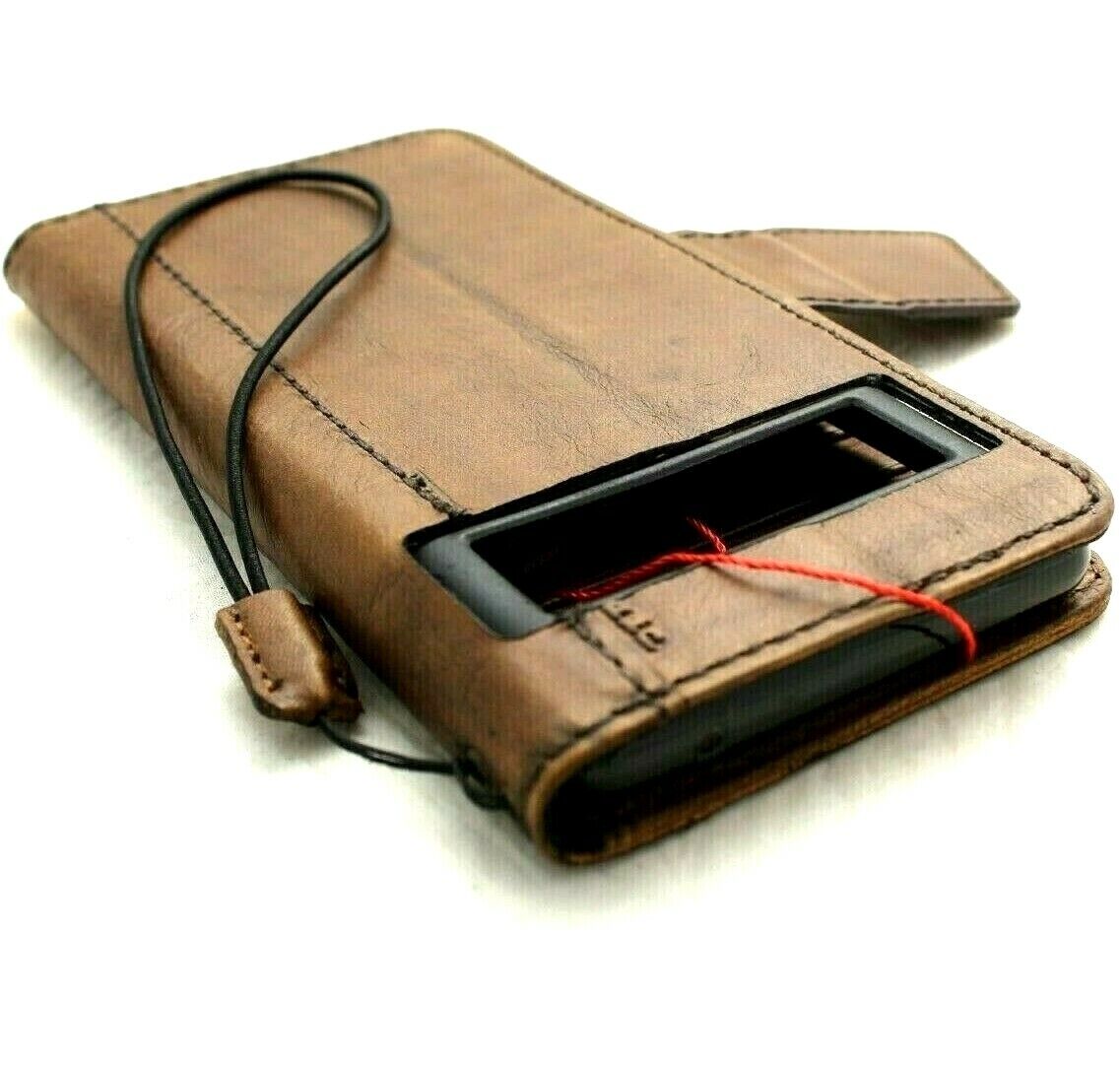 Genuine leather Google Pixel 7 Pro case by DAVISCASE with wallet, magnetic closure, stand feature, dark color, and wireless charging compatibility.