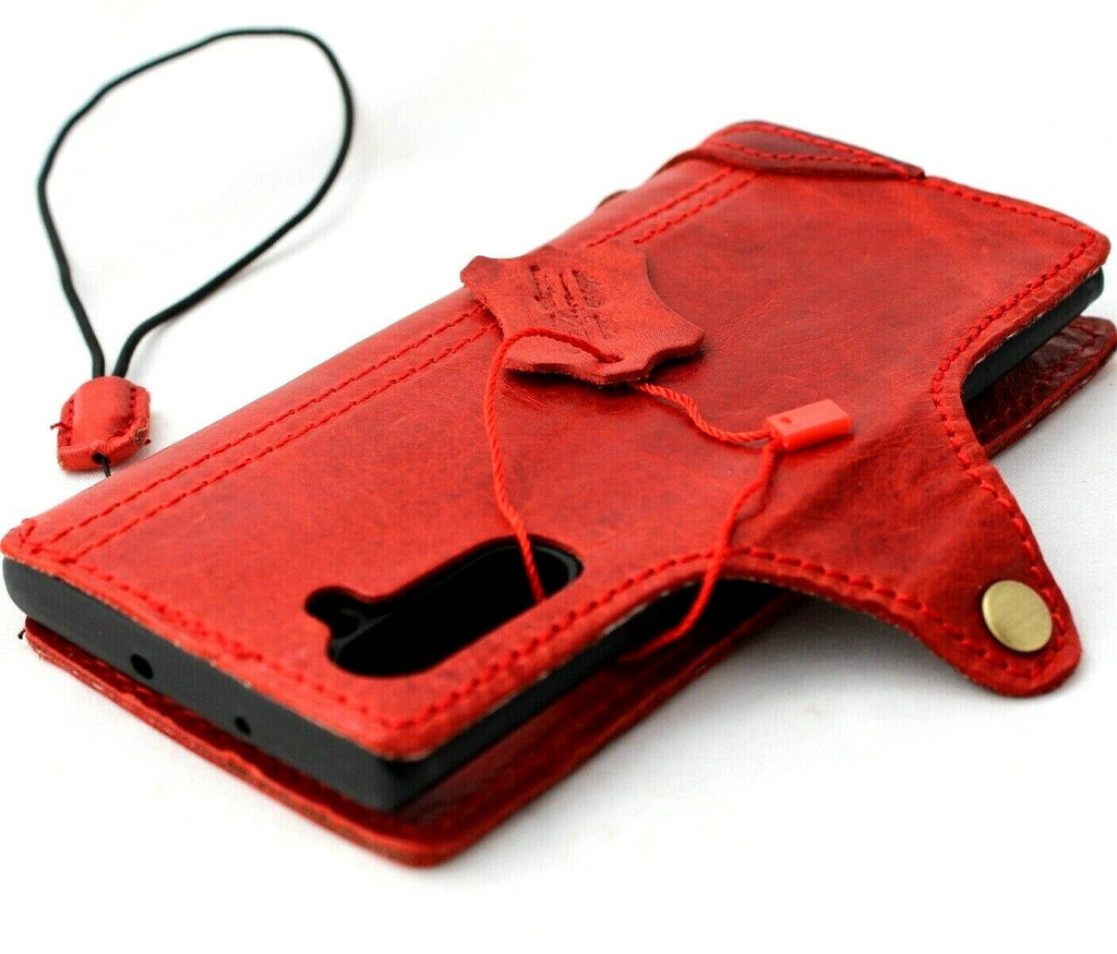 Red genuine leather flip wallet case for Samsung Galaxy Note 10, handmade by DAVISCASE, with slim design and strap detail.
