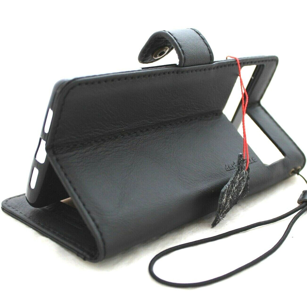 Black genuine leather Google Pixel 7 Pro case with wallet-style book cover, stand feature, and wireless charging compatibility.