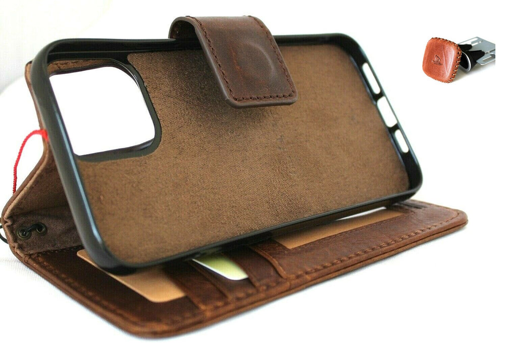 Genuine dark leather iPhone 12 Pro Max case with wallet design, ID window, credit card slots, magnetic cover, and car holder by DAVISCASE.