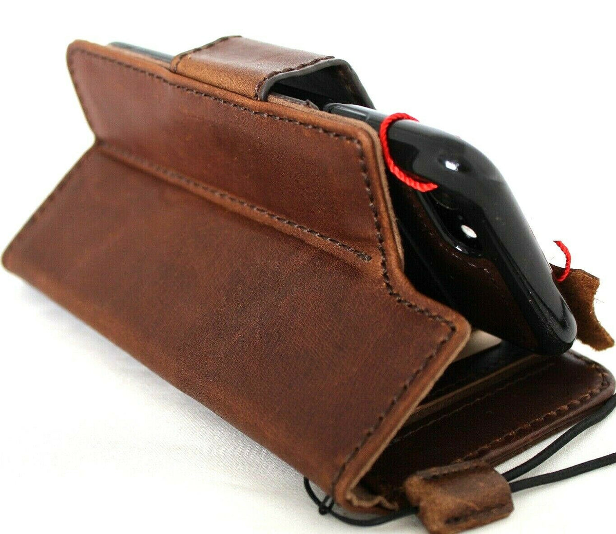 Dark leather iPhone SE 2 case by DavisCase with wallet card slots, ID window, removable cover, rubber holder, and strap.
