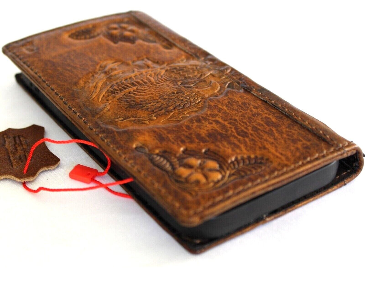 Handmade leather phone case for iPhone models with vintage tan finish, credit card slots, and embossed eagle design by DAVISCASE.