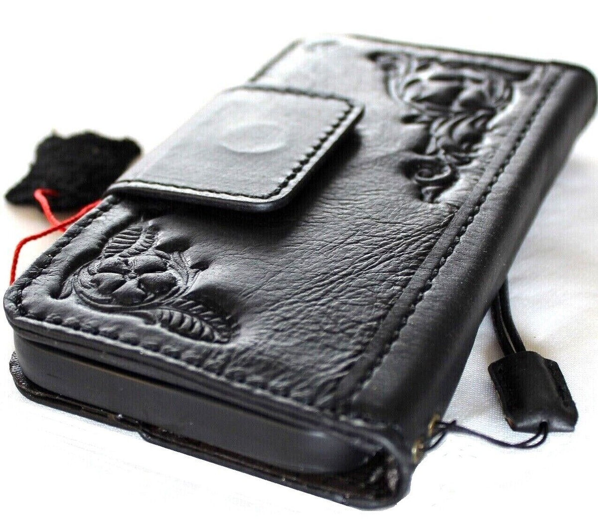 Black genuine leather Google Pixel 7 Pro wallet case with magnetic closure, stand feature, embedding decorations, and wireless charging compatibility.