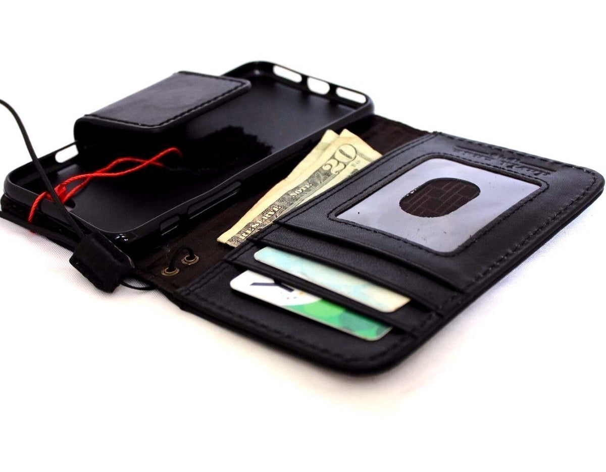 Black genuine leather iPhone 8 case with wallet card slots and magnetic closure, compatible with wireless charging, by Davis.