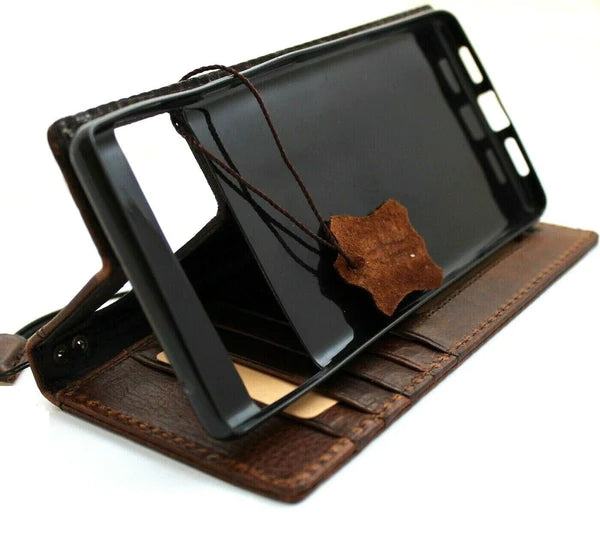 Dark retro genuine leather book wallet case for OnePlus 15, 13, 13R, 12, 12R with stand feature and wireless charging compatibility.