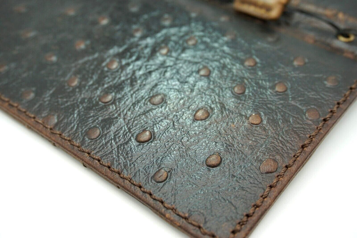Genuine leather Google Pixel 7 Pro case by DAVISCASE, dark ostrich pattern, wallet style with wireless charging capability.