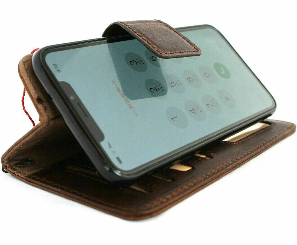 Genuine dark leather Apple iPhone XS case by DAVISCASE with vintage wallet design, magnetic closure, credit card slots, and removable cover.