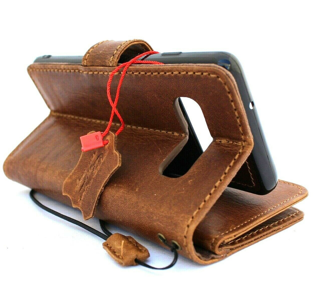Genuine leather Samsung Galaxy S10 book wallet case by DAVISCASE with card slots, rubber window, flip closure, and magnetic removable cover.