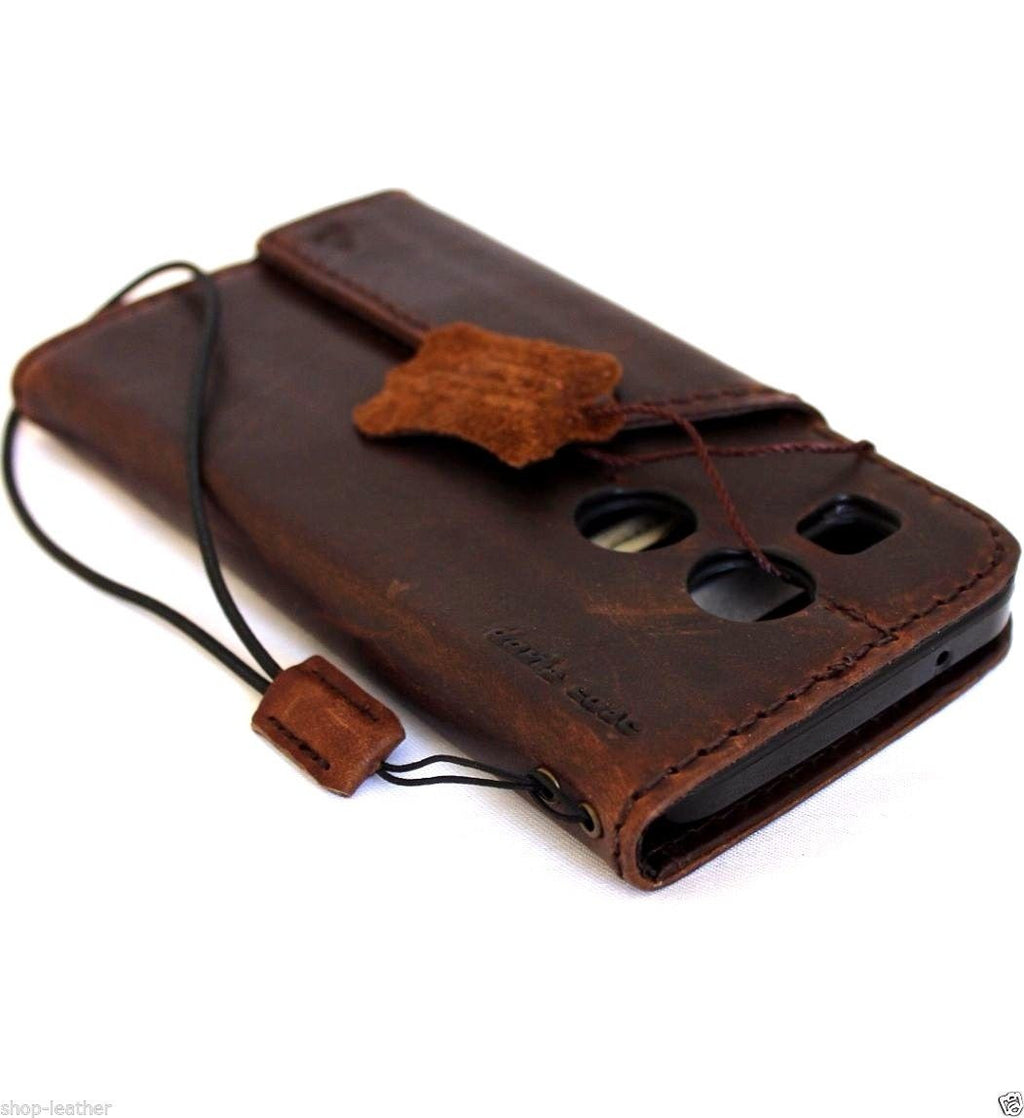 Dark brown genuine Italian leather hard case for LG Nexus 5X with wallet-style design, card slots, and magnetic closure.