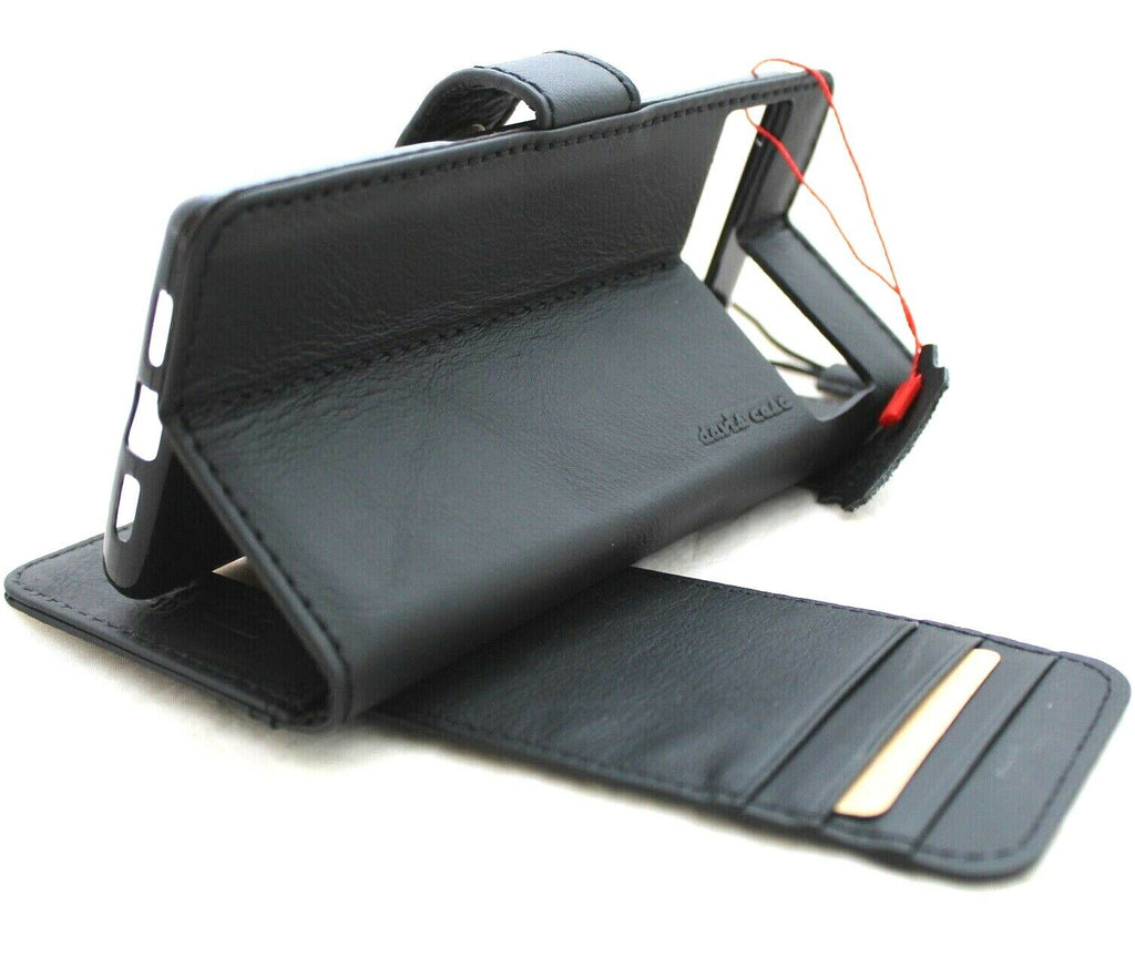 Black genuine leather Google Pixel 7 Pro case with wallet design, stand feature, and magnetic closure by DAVISCASE.