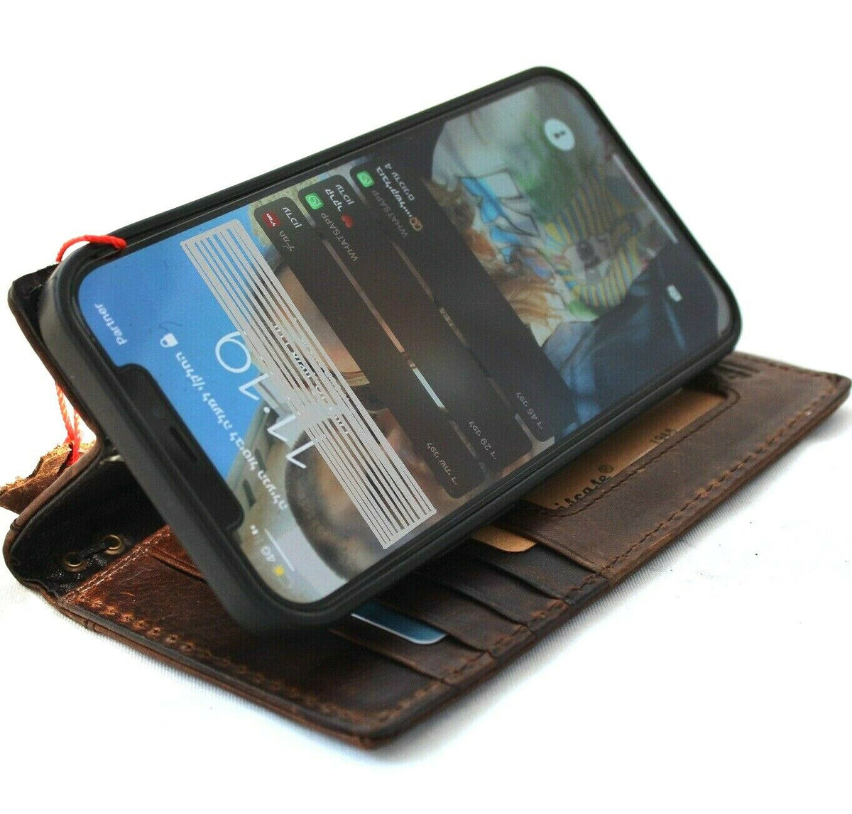 Vintage dark leather wallet phone case for iPhone models, featuring a mini dog paw design, by DAVISCASE, with card slots and magnetic closure.