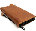 Genuine tan leather galaxy S10e Daviscase wallet cover with card slots, strap, and charging port opening.