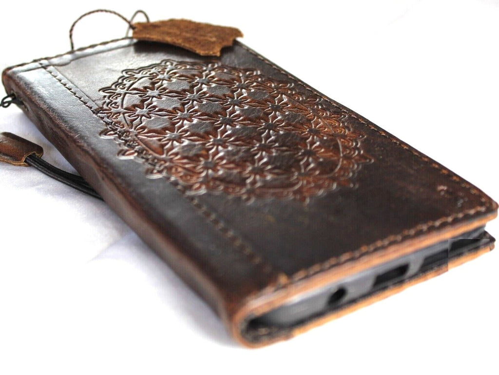 Genuine leather Google Pixel 7 Pro case by DAVISCASE with retro book wallet design, stand, wireless charging compatibility, and decorative accents.