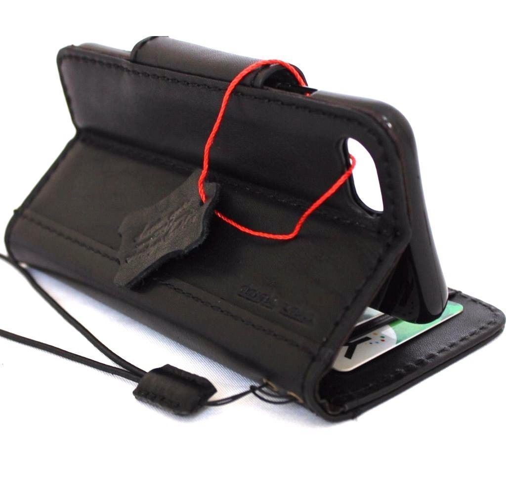 Black genuine leather iPhone 8 case with wallet card slots and magnetic closure, designed for wireless charging.