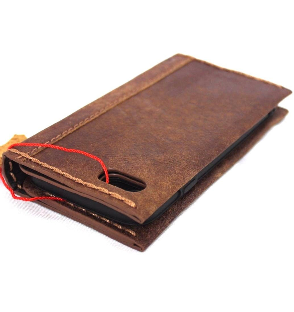 Handmade genuine leather iPhone 8 case by DAVISCASE, vintage book wallet with card slots and soft wireless charging feature.