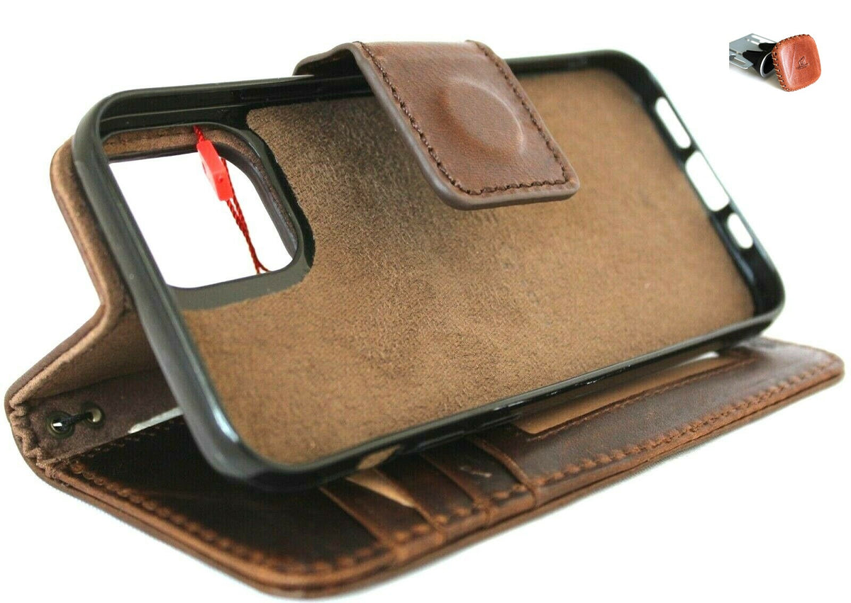 Dark natural leather case for iPhone 12 Pro by DAVISCASE, vintage style book wallet with ID window, card slots, and magnetic car holder.