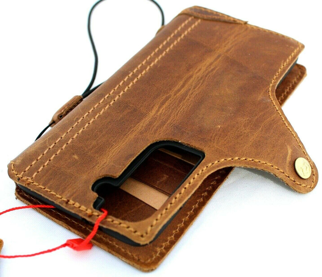 Handmade tan leather wallet phone case for Samsung Galaxy S21, with rubber holder and slim design, wireless charging compatible.