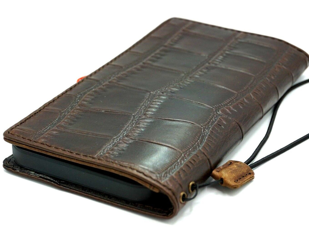 Handmade genuine leather phone case for iPhone models, DAVISCASE crocodile style wallet book with minimal design and card slots.