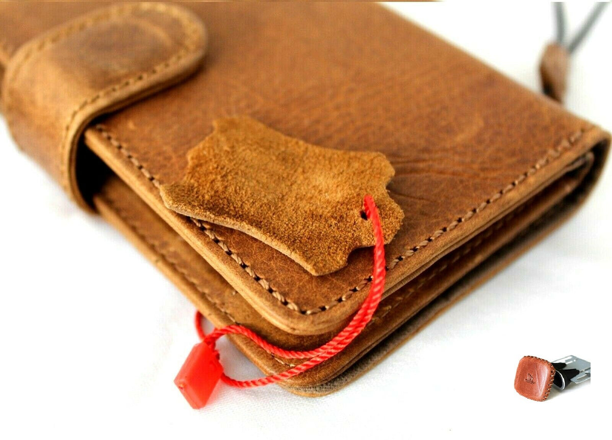 Genuine tan leather iPhone 12 Mini case with wallet slots, magnetic closure, detachable cover, and car holder by DAVISCASE.