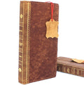 Genuine leather iPhone 8 case with book-style wallet design, vintage look, slim fit, and space for cards, compatible with wireless charging.