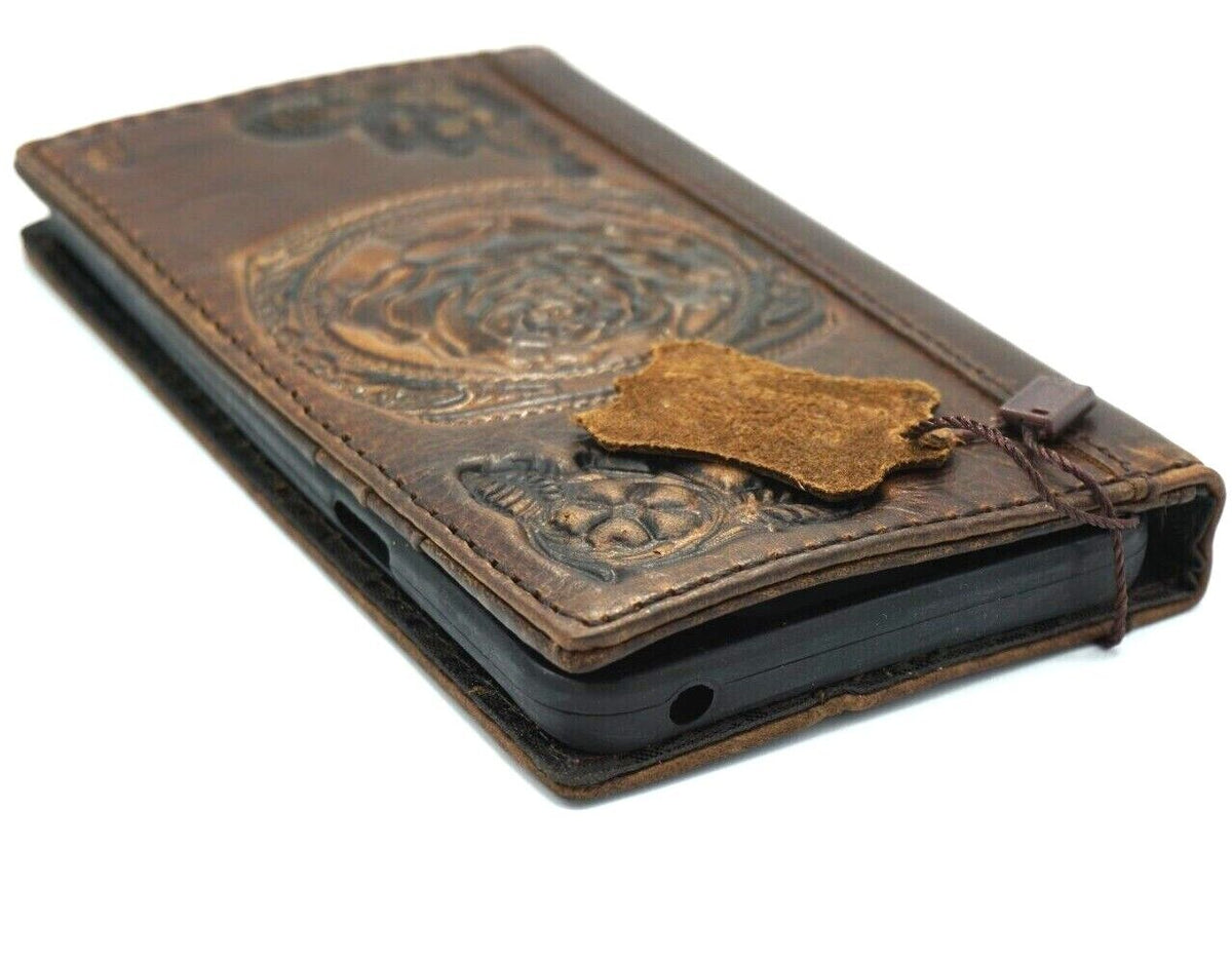 Handmade genuine leather phone case for iPhone models with embossed rose flower design and credit card slots by DAVISCASE