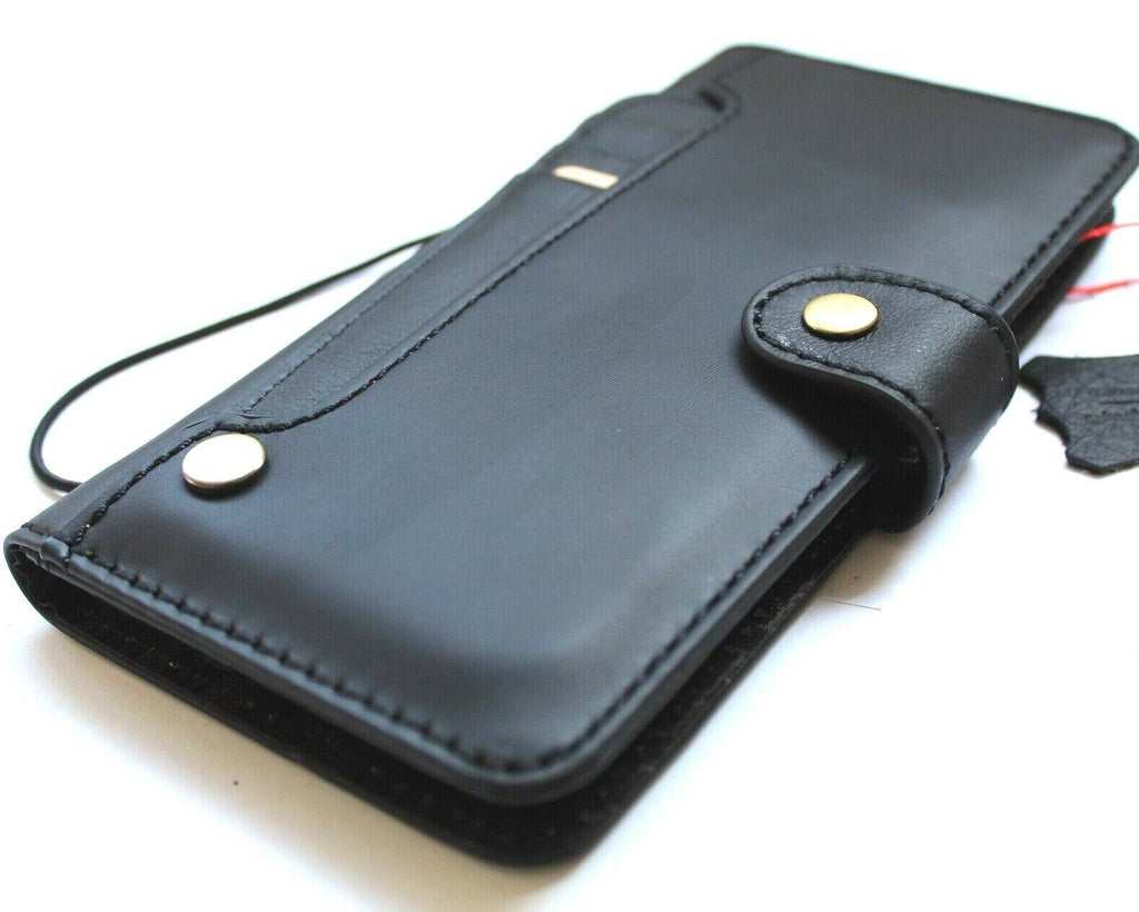 Black genuine leather Google Pixel 7 Pro case with wallet-style design, stand feature, and wireless charging compatibility by DAVISCASE.