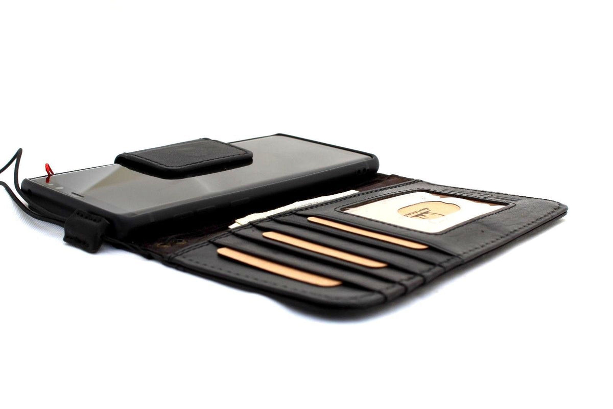 Black genuine leather Google Pixel 7 Pro case with magnetic closure, wallet design, stand, and wireless charging embedding by DAVISCASE.