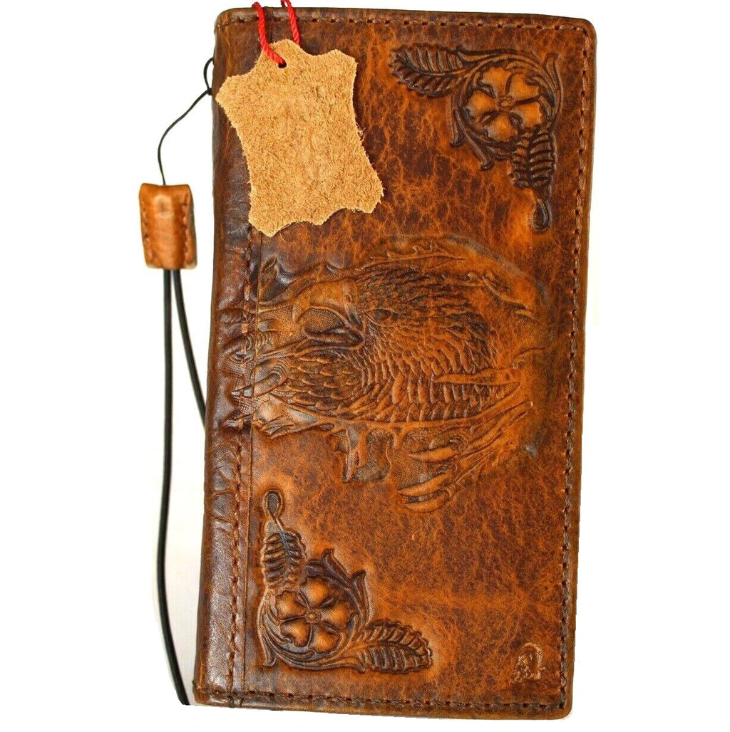 Handmade DAVISCASE leather phone case with vintage tan finish, credit card slots, for iPhone models, featuring eagle craft stamping design.