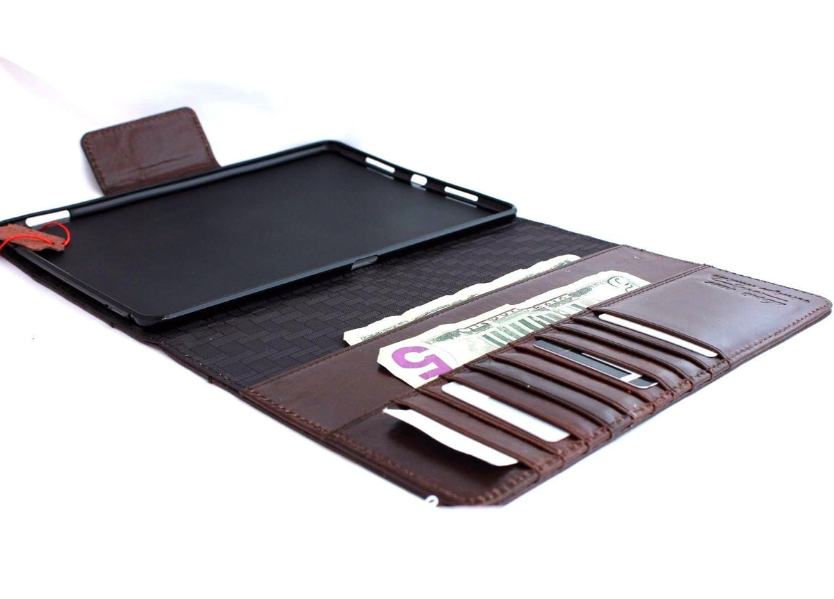 Brown leather iPad Pro 9.7 case by DAVISCASE with card slots, flip cover, stand feature, slim design, and magnetic closure.
