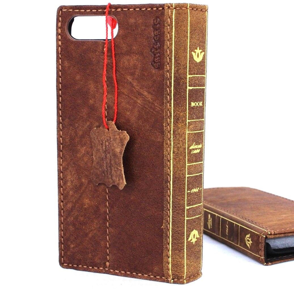 Genuine full leather iPhone 8 case with book-style wallet design, vintage look, slim fit, and slots for cards, compatible with wireless charging